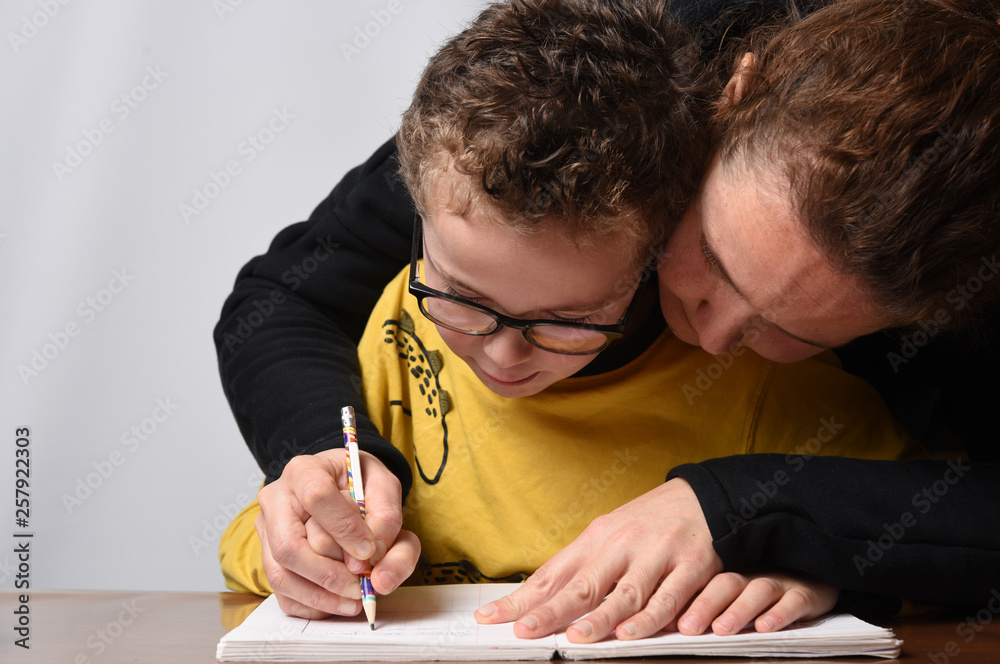 child with glasses who learns to write child with glasses who learns to write