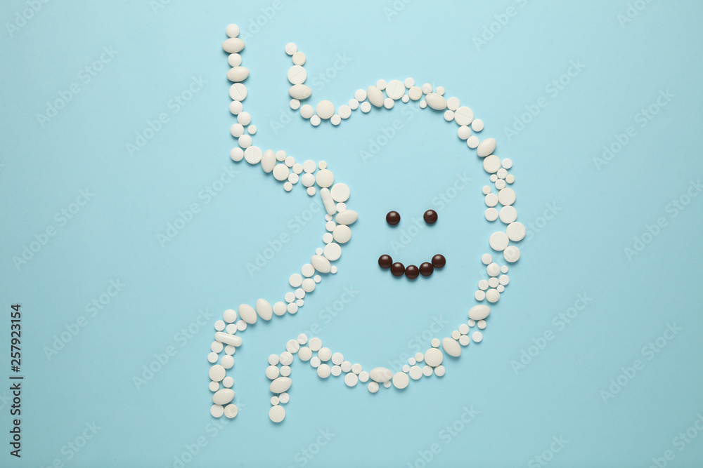 Cheerful face in stomach of pills. Healthy lifestyle, good digestion. Cheerful face in stomach of pills. Healthy lifestyle, good digestion.