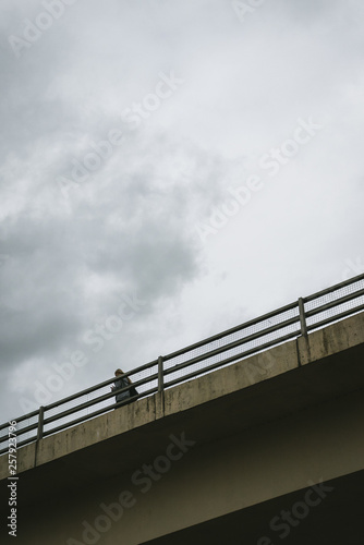 Woman Crossing On The Bridge