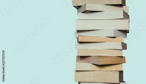 Literature for study: Stack of books; blue background