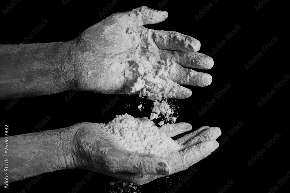 close up hands kneading dough. black and white close up hands kneading dough. black and white