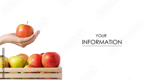 Wooden box of apples carrots in hand pattern on white background isolation