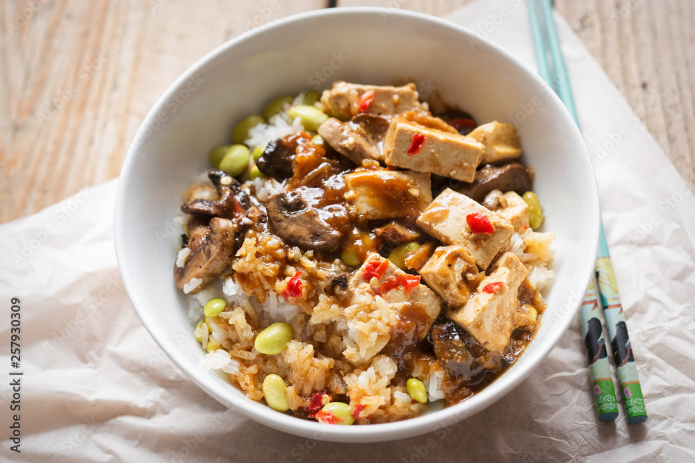 Sticky teriyaki tofu with rice, edamame beans and red chillies Sticky teriyaki tofu with rice, edamame beans and red chillies