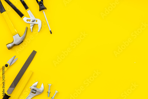 instruments of constructor for build, paint and repair house on yellow background top view mockup photo