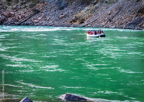 Young person rafting on the river Ganges in Rishikesh, extreme and fun sport at tourist attraction © Peppygraphics