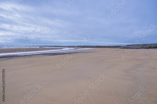 The Vast Expance of San at the Beach Park in Irvine Scotland with the Old harbour in the Distance.