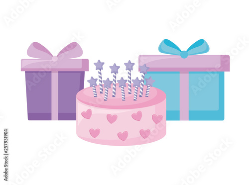sweet cake with candles and gifts boxes
