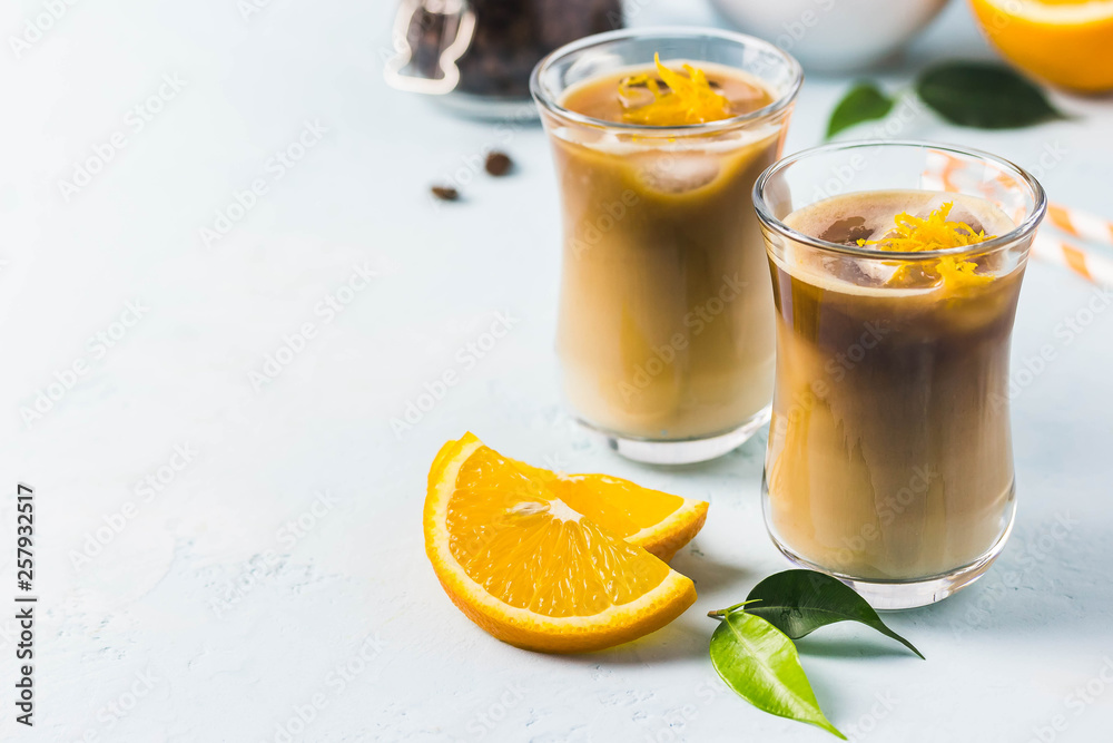 Fototapeta premium Creamy orange iced coffee . Selective focus, space for text.