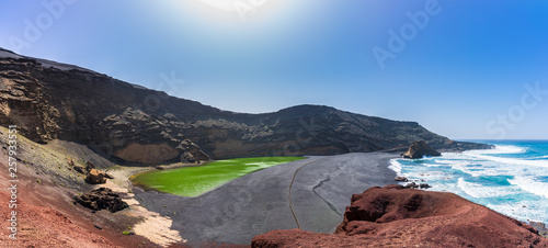 Spain, Lanzarote, XXL panorama of green lagoon of el golfo west coast village photo