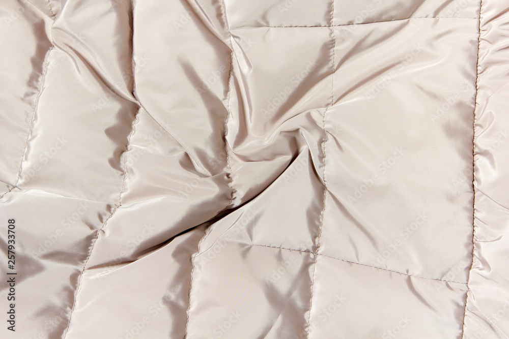 Obraz premium quilted beige raincoat fabric