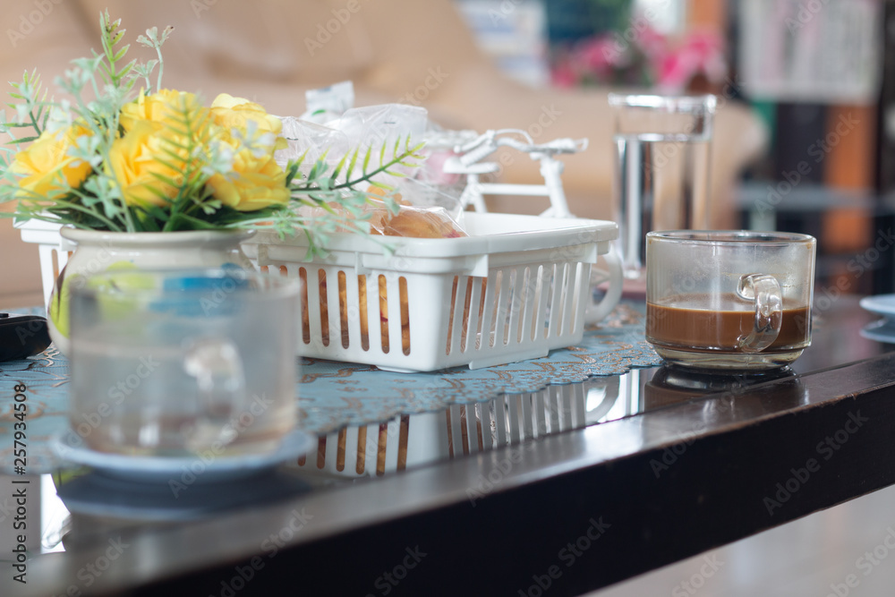 A coffee cup on wooden desk