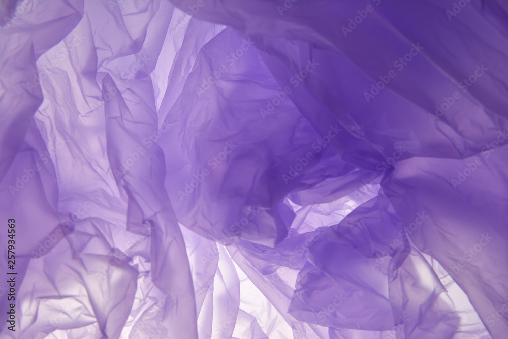 Obraz premium Plastic bag background. Purple abstract soft background. Suitable as a blank for a wedding invitation, greeting card or advertising. Plastic concept.