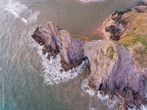 Aerial view of Three Cliffs Bay south coast beach the Gower Peninsula Swansea Wales uk photo