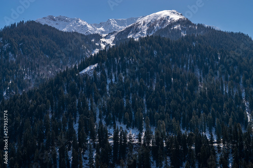 Fototapeta Naklejka Na Ścianę i Meble -  Snow Covered Mountain Against Blue Sky In Himachal Pradesh, India