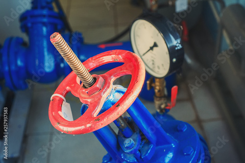 red valve and pressure sensor on the gas supply or heating pipe.
