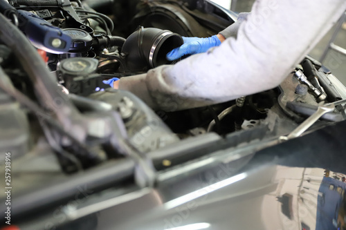 Mechanic fixing the turbo adding more horse power