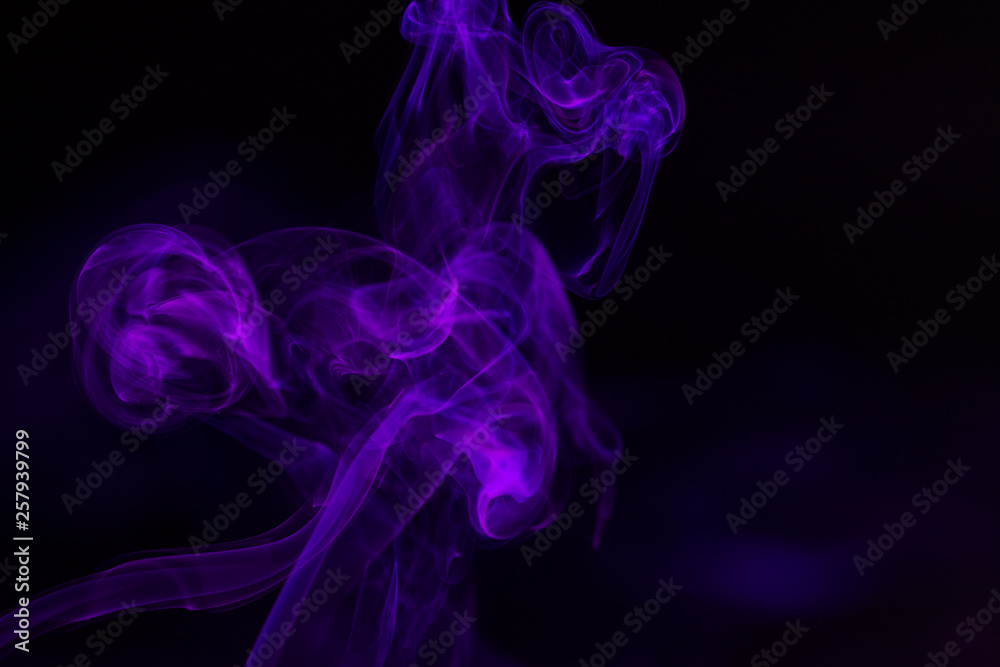 Colorful smoke close-up on a black background Colorful smoke close-up on a black background
