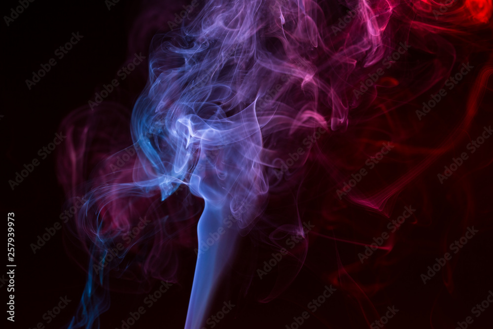 Colorful smoke close-up on a black background Colorful smoke close-up on a black background