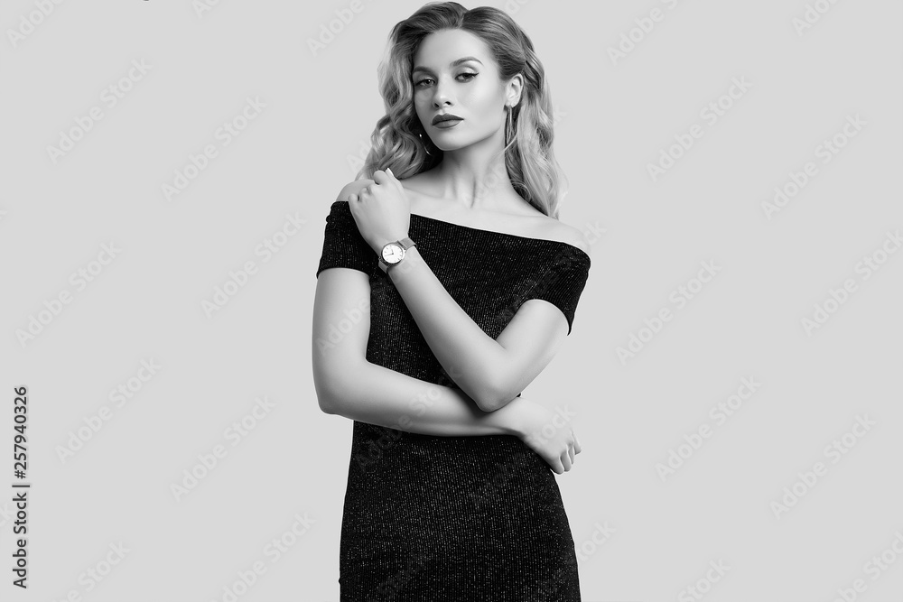 Gorgeous elegant sensual blonde woman wearing fashion black dress Gorgeous elegant sensual blonde woman wearing fashion black dress
