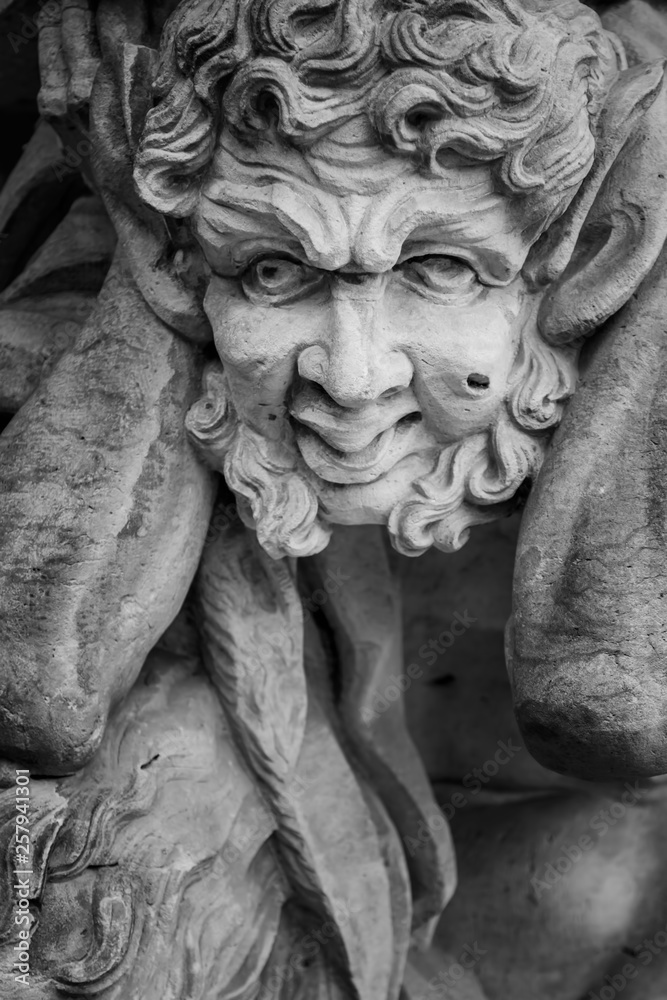 Zegevieren in de buurt haalbaar Antique statue of Pan (Faunus in Roman mythology). God of the wild, nature  and rustic music. He has the hindquarters, legs, and horns of a goat. Black  and white image. Stock Photo 