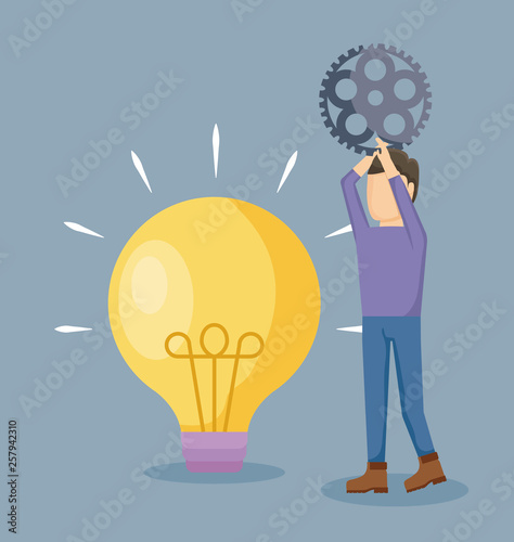 man holding pinion with light bulb