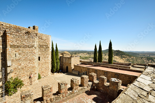 View of medieval Luna Castle against blue sky photo