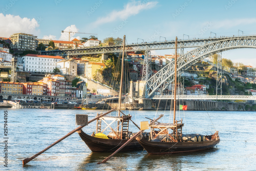 Obraz premium Vessels with the barrels of port on Douro River. Porto, Portugal.