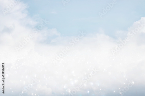 image of clouds in the blue sky with glitter