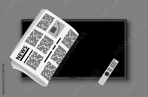 Modern TV and folded newspaper on its background. News and important events. Article or TV show with the news.