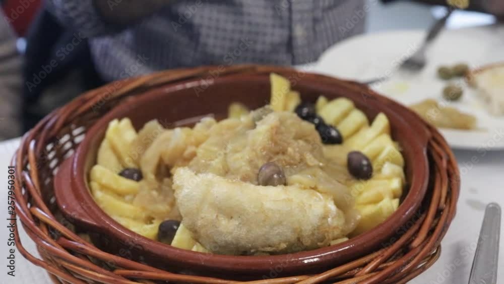 cod fish with onion and potato in ceramic dish cod fish with onion and potato in ceramic dish