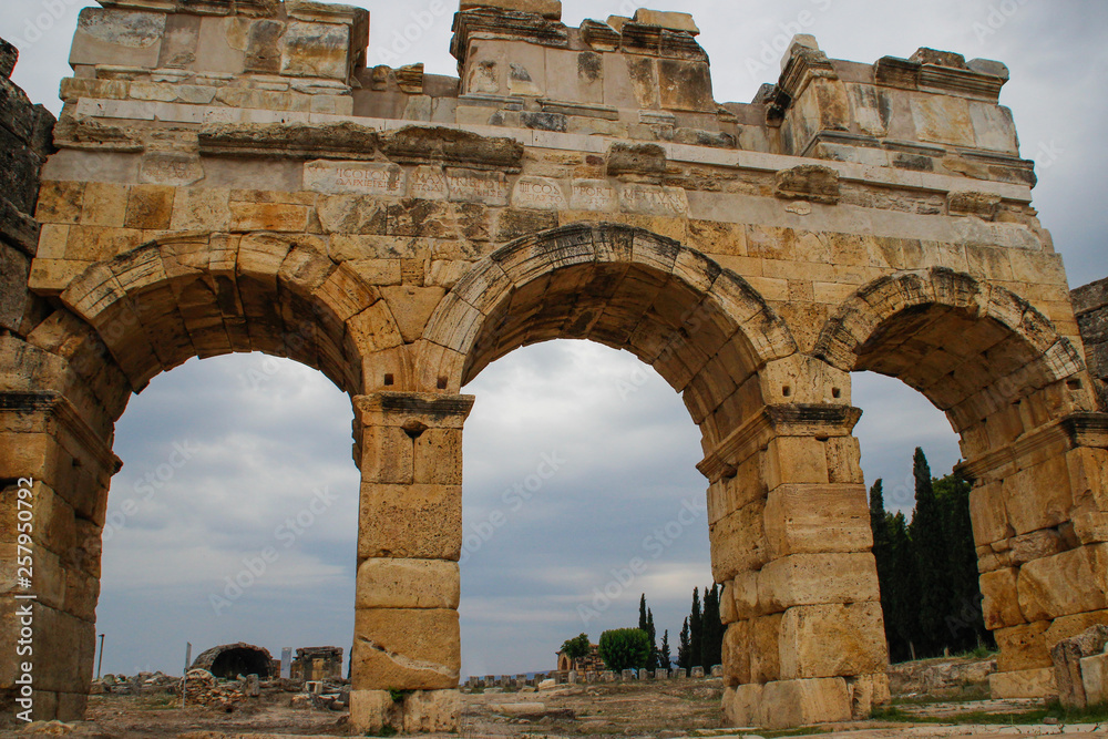 The ruins of the ancient ancient city of Hierapolis with columns, gates and graves in Pamukalle, Turkey