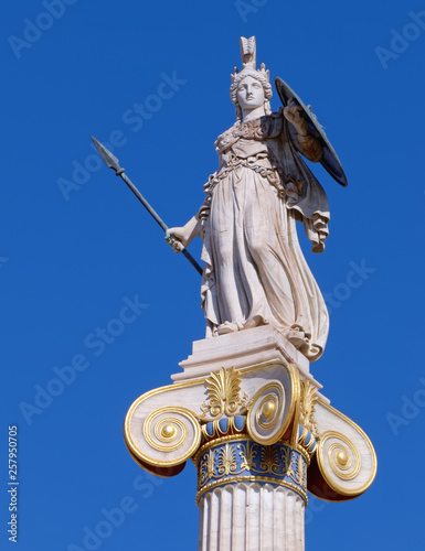 Athena statue the ancient greek goddess of science and wisdom  on crystal clear blue sky background