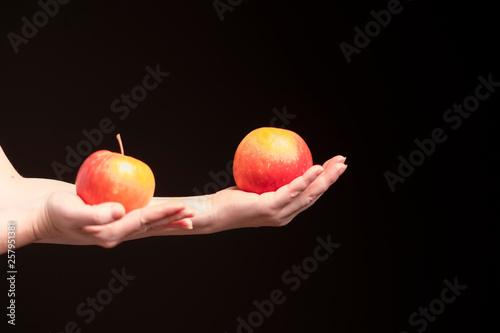 red apple on girl's hand
