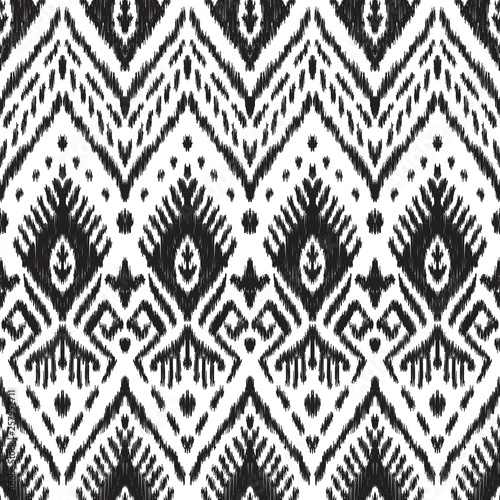 Black and white seamless background. Ethnic ikat ornament. Vector illustration. Tribal pattern. Can be used for textile, wallpaper, wrapping paper, greeting card backdrop, print.