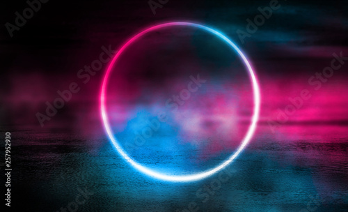 Background of empty stage  room. Reflection on wet pavement  concrete. Neon blurry lights. Neon circle figure in the center  smoke