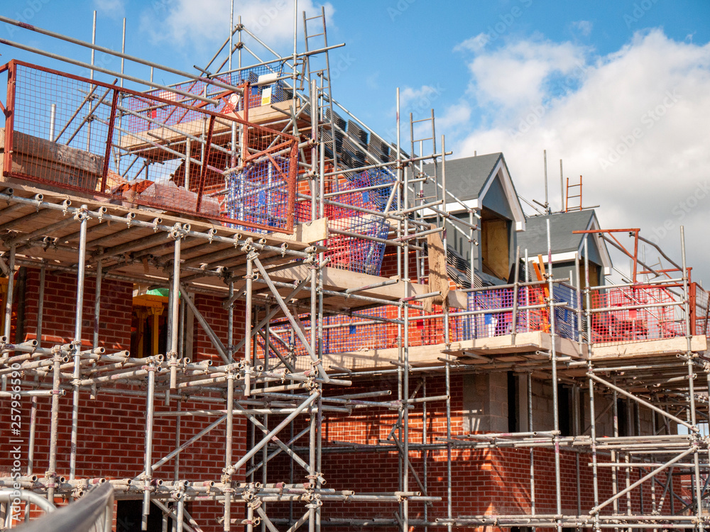 Newly build homes in scaffolding UK