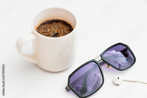 Top view coffee and sunglasses on Flat lay