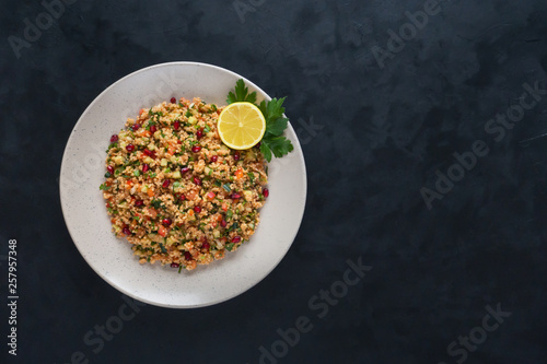 Ramadan food. Salad with couscous and pomegranate.