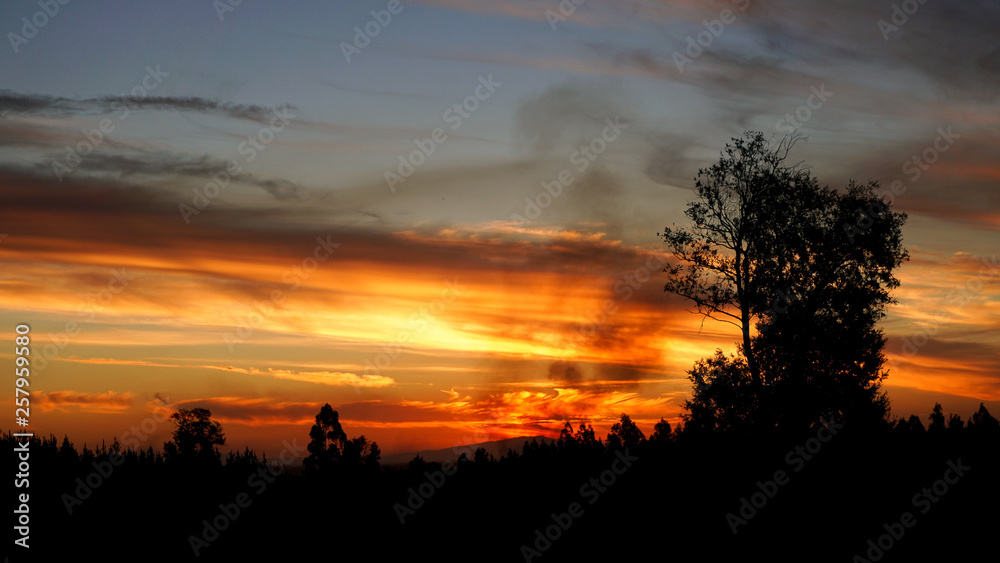 Beautiful Sunset during Road Trip in South America with Smoke Clouds 