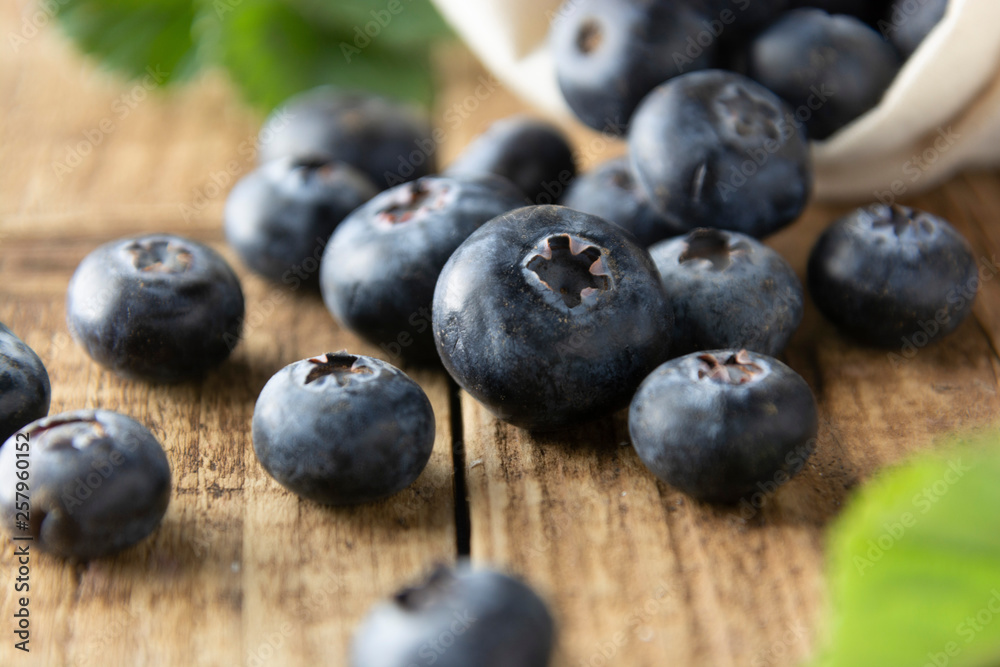 Fresh blueberries, close up on rustic wooden surface. Concept for healthy eating and nutrition. Fresh blueberries, close up on rustic wooden surface. Concept for healthy eating and nutrition.