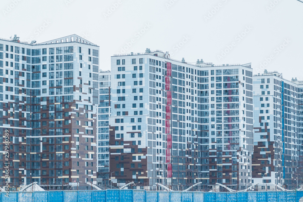 Construction of a new house. Construction in the modern quarter. New high-rise building. new multi-storey residential buildings. The construction of a new housing estate. The exterior fragment