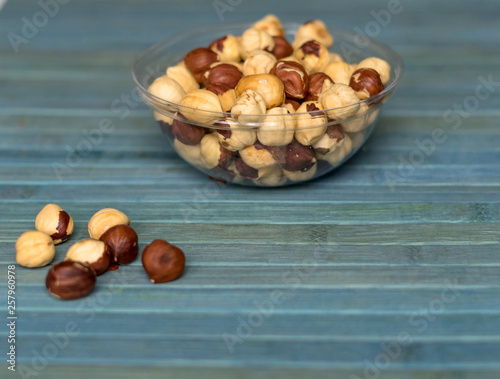 Healthy food  for background image close up hazelnuts.  Nuts texture on top view on the cup plate