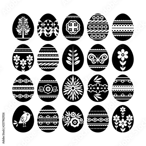 Silhouettes of black easter eggs isolated on white background. Holiday Easter Eggs decorated with flowers and leafs. Print design, label, sticker, scrap booking, stamp, vector illustration