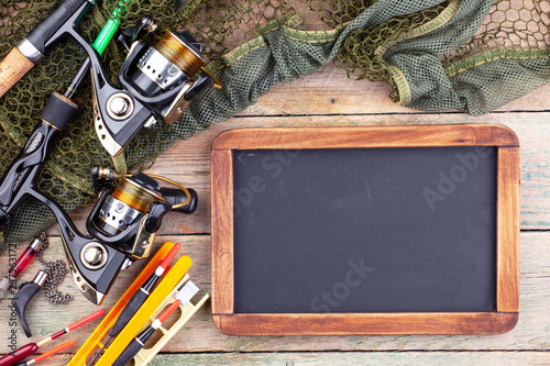 fishing tackle on a wooden table. 