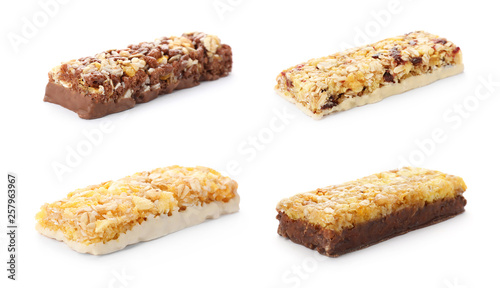 Set of different sweet protein bars on white background