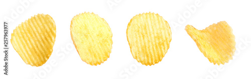 Set of tasty ridged potato chips on white background