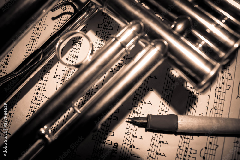 Naklejka premium Background of a trumpet on sheet music