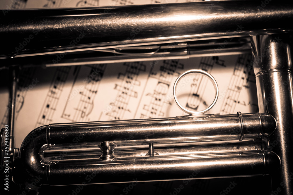 Naklejka premium Background of a trumpet on sheet music