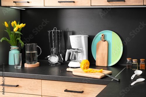 Fotografi Stylish kitchen counter with set of houseware