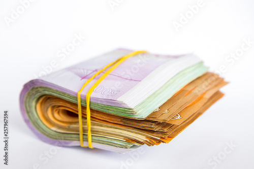 Pile of Euro banknotes isolated on a white background